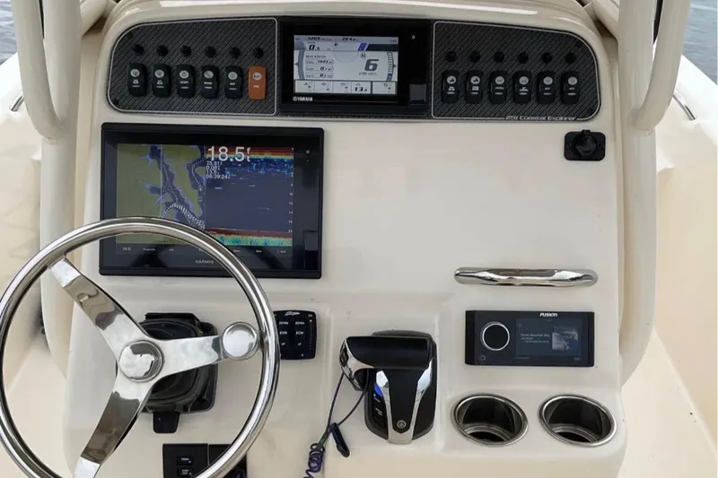 Slide: The Image of 2021 Grady-White 251 Coastal Explorer dashboard with navigation and control systems. - 4