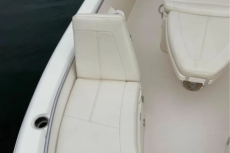 Slide: The Image of 2021 Grady-White 251 Coastal Explorer boat interior with white seating. - 7