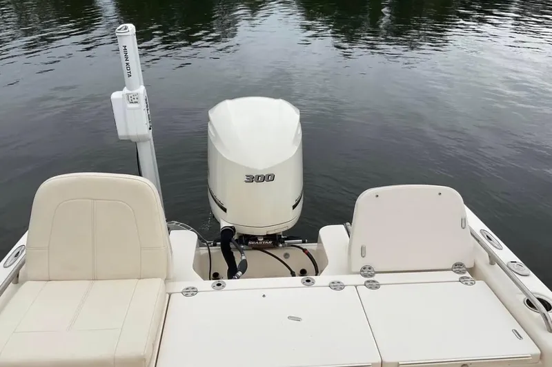 Slide: The Image of 2021 Grady-White 251 Coastal Explorer boat with 300 HP engine on calm water. - 8