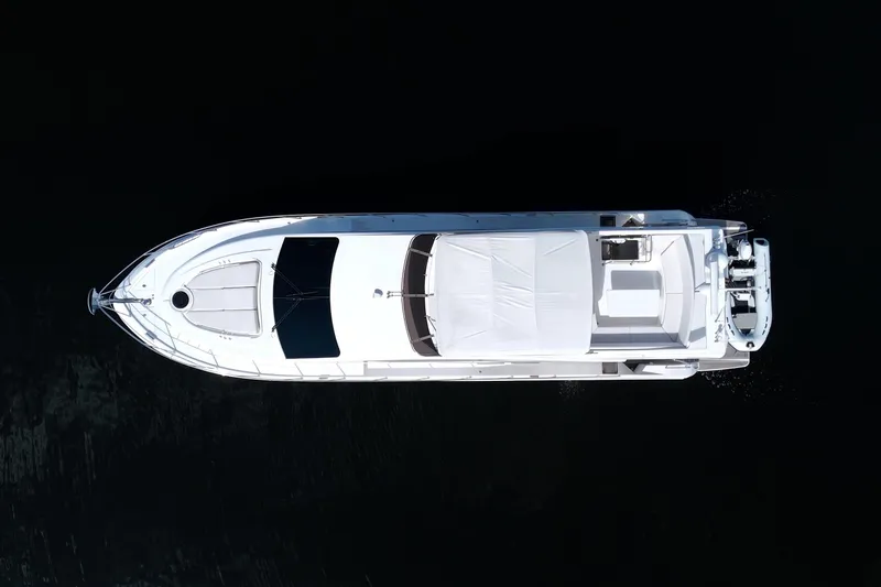 Slide: The Image of Aerial view of 2015 Dyna 60 yacht on dark water. - 1