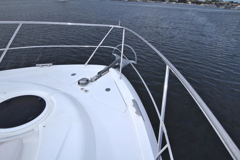 Slide: The Image of Bow of 2015 Dyna 60 yacht with stainless steel railings on calm water. - 24