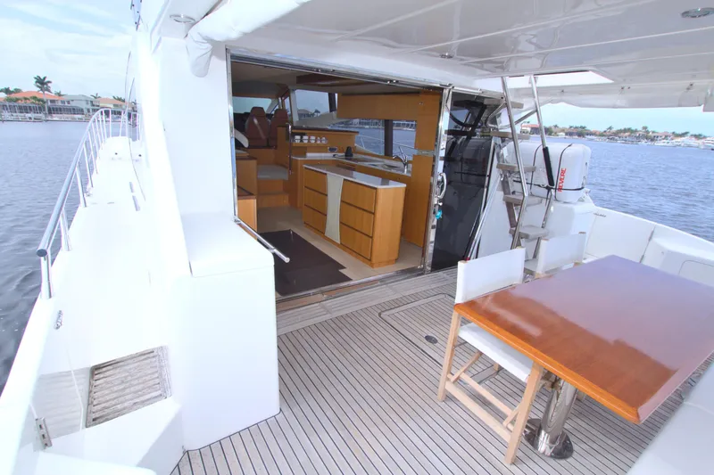 Slide: The Image of Luxury yacht Dyna 60, 2015 model, featuring spacious deck and modern interior design. - 33