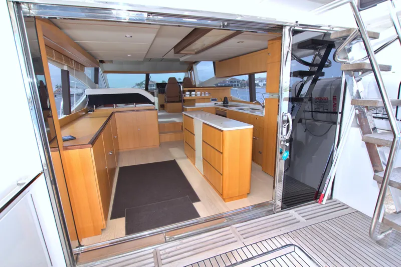 Slide: The Image of Luxurious interior of 2015 Dyna 60 yacht with modern wooden cabinetry and sleek design. - 34