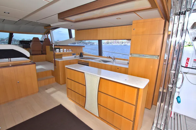 Slide: The Image of Luxurious 2015 Dyna 60 yacht interior with modern kitchen and scenic ocean view. - 38