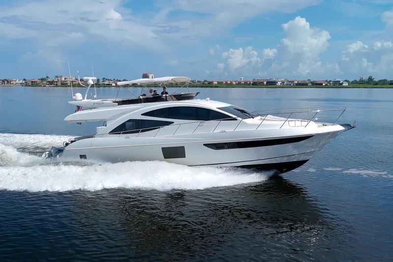 Slide: The Image of Luxury Dyna 60 yacht cruising on calm waters, 2015 model. - 4