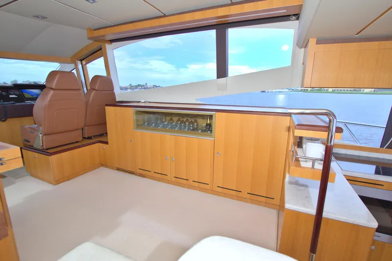 Slide: The Image of Luxurious interior of 2015 Dyna 60 yacht with elegant wood cabinetry and panoramic windows. - 40
