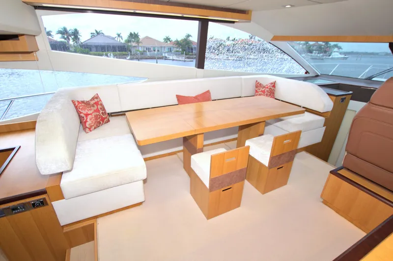 Slide: The Image of Luxurious interior of 2015 Dyna 60 yacht with elegant seating and scenic window view. - 44