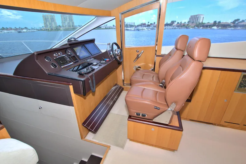 Slide: The Image of Luxurious 2015 Dyna 60 yacht helm with leather seats and modern controls. - 46