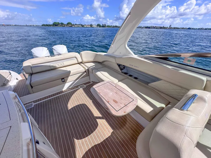 Slide: The Image of 2019 Regal 33 OBX boat interior with luxurious seating and ocean view. - 39