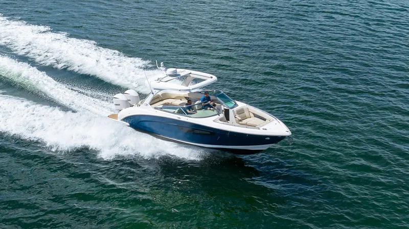 Slide: The Image of 2019 Regal 33 OBX boat cruising on open water. - 5