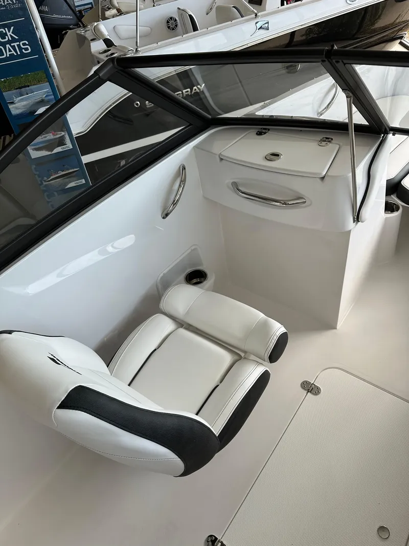 Slide: The Image of 2026 Stingray 191 DC boat interior with white and black seating. - 4