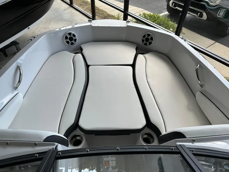 Slide: The Image of 2026 Stingray 191 DC boat interior with cushioned seating and cup holders. - 5