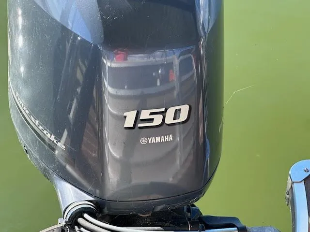 Slide: The Image of Yamaha 150 outboard motor on a 2015 Xcursion X21F boat. - 18
