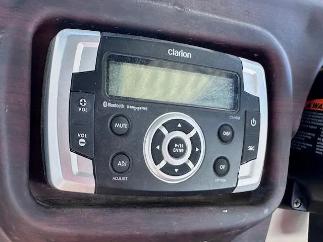 Slide: The Image of Clarion audio system in 2015 Xcursion X21F boat dashboard. - 26