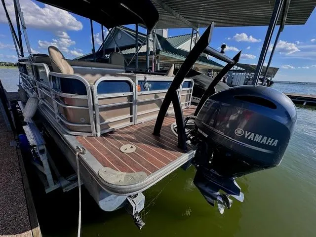 Slide: The Image of 2015 Xcursion X21F pontoon boat with Yamaha outboard motor docked on a sunny day. - 6