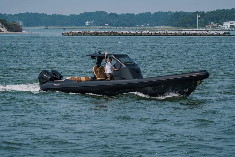 Slide: The Image of 2023 Ribco Seafarer 36 X cruising on open water with dual Mercury engines. - 0