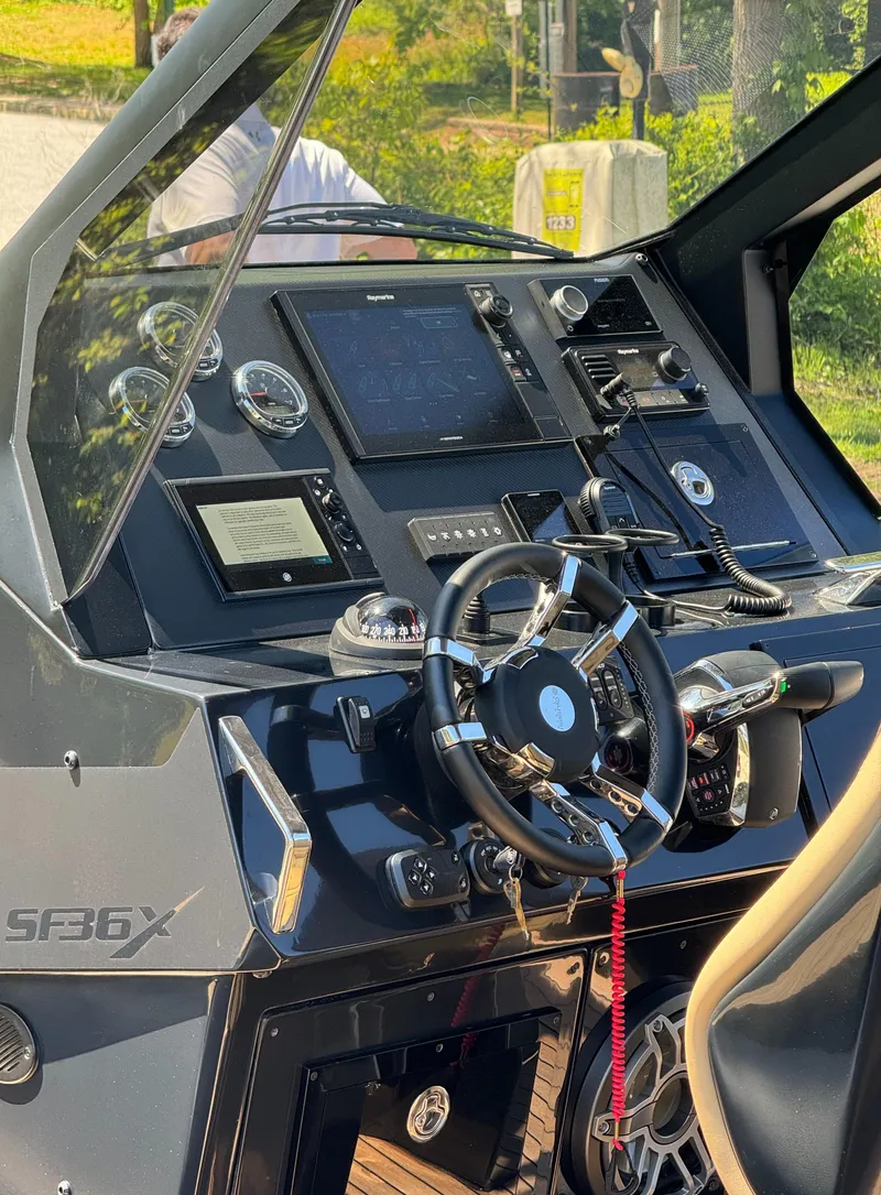 Slide: The Image of Cockpit of 2023 Ribco Seafarer 36 X with advanced navigation controls and steering wheel. - 11