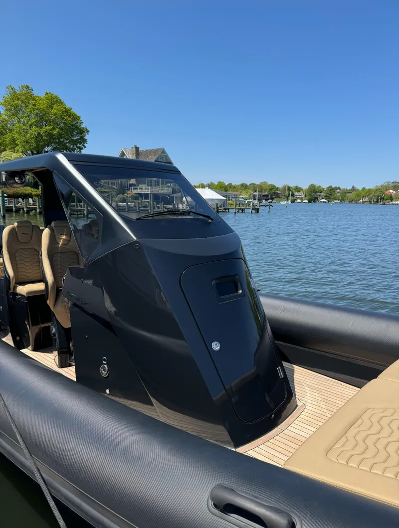 Slide: The Image of 2023 Ribco Seafarer 36 X boat on a sunny day by the water. - 12