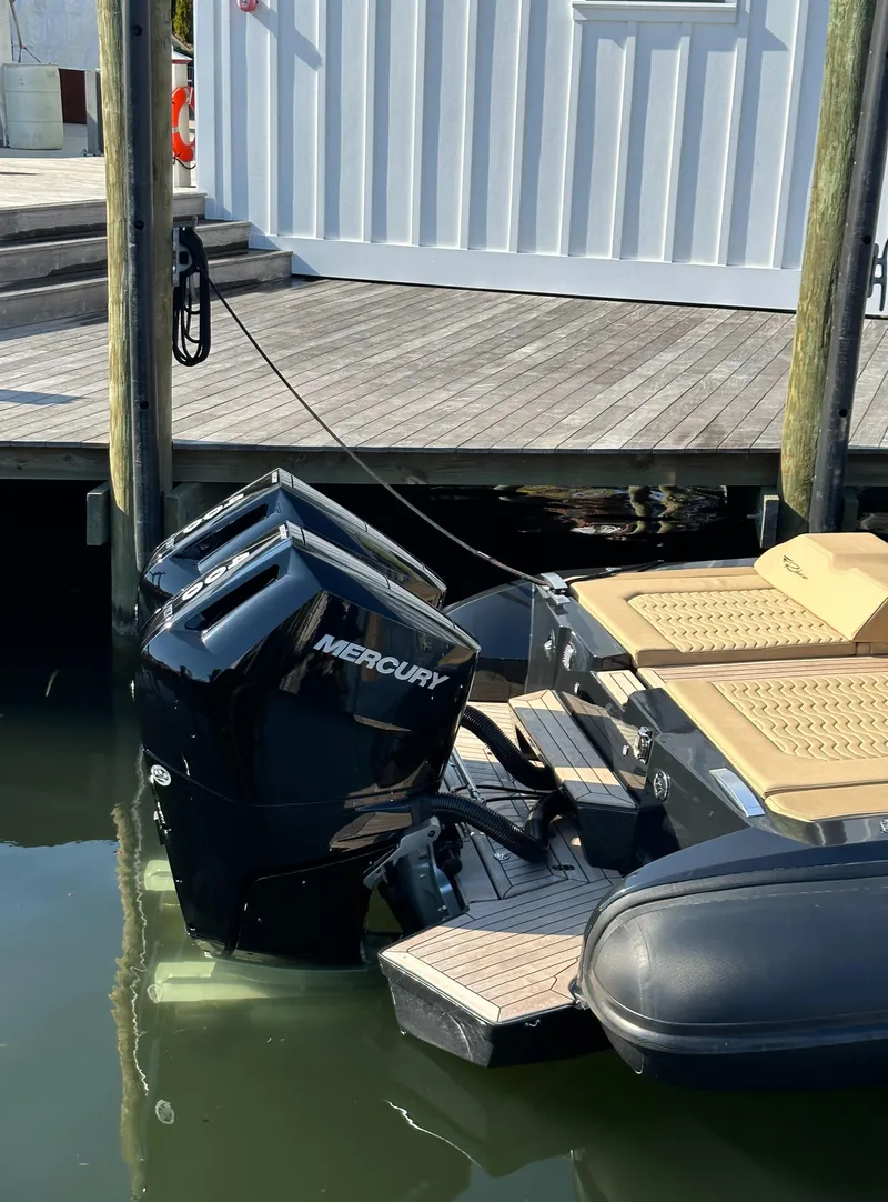 Slide: The Image of 2023 Ribco Seafarer 36 X with Mercury engines docked at a marina. - 17