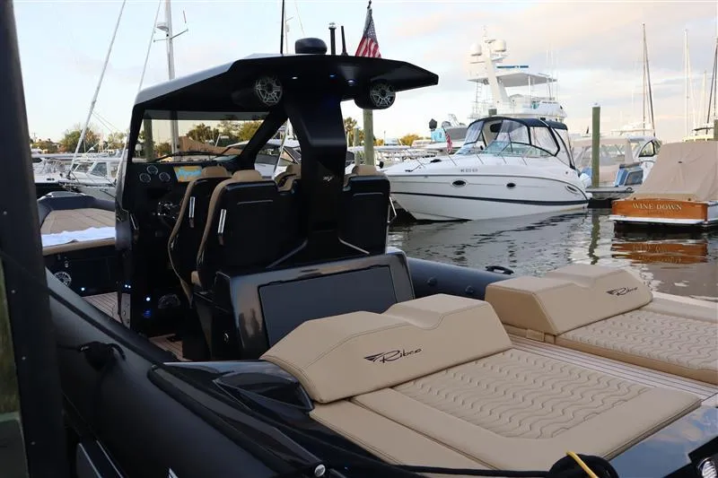 Slide: The Image of 2023 Ribco Seafarer 36 X luxury boat interior at marina, featuring sleek design and comfortable seating. - 19