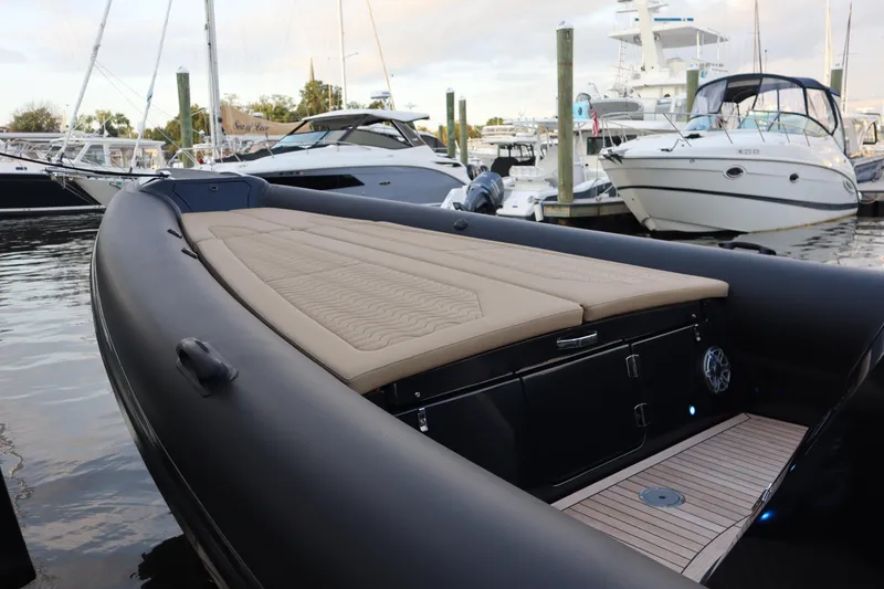 Slide: The Image of 2023 Ribco Seafarer 36 X luxury boat docked at marina, featuring sleek design and spacious deck. - 24