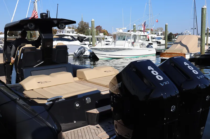 Slide: The Image of 2023 Ribco Seafarer 36 X boat with twin Mercury 400 V10 engines docked at marina. - 5