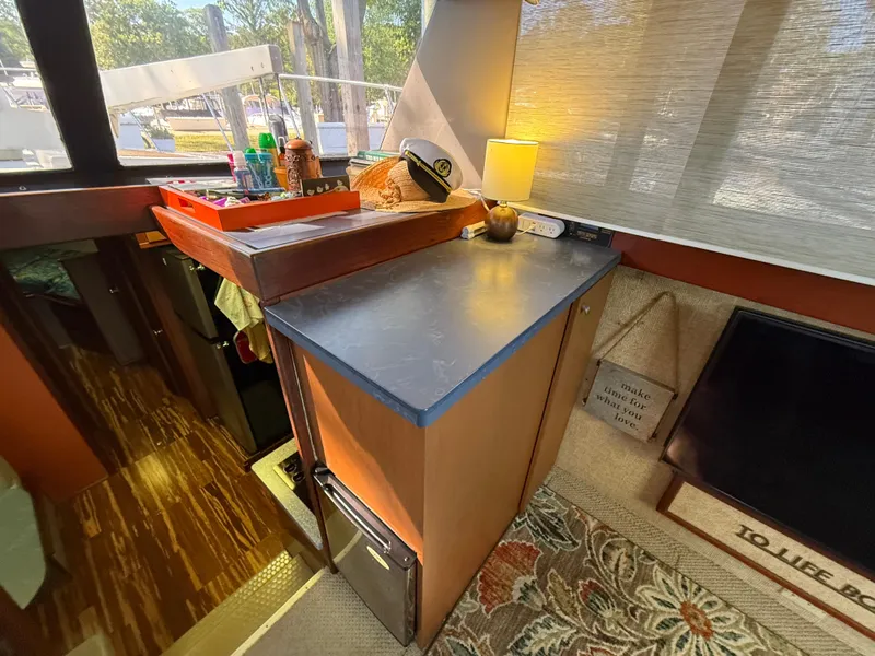 Slide: The Image of 1980 Viking 43 Double Cabin interior with counter, lamp, and nautical decor. - 22