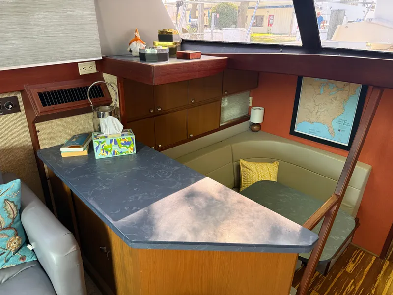 Slide: The Image of Interior of 1980 Viking 43 Double Cabin with cozy seating and nautical decor. - 23