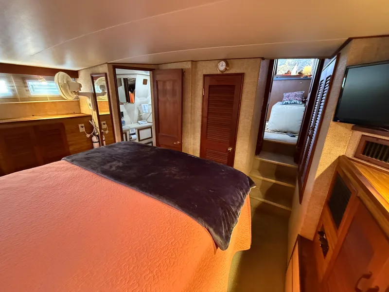Slide: The Image of Interior of 1980 Viking 43 Double Cabin with cozy bedroom and wooden furnishings. - 37