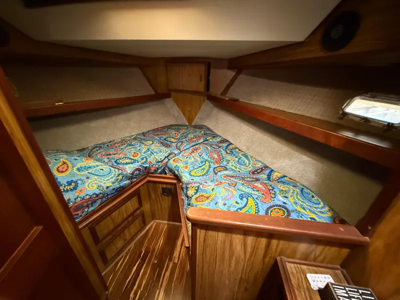 Slide: The Image of Cozy cabin interior of 1980 Viking 43 Double Cabin with colorful bedding. - 38