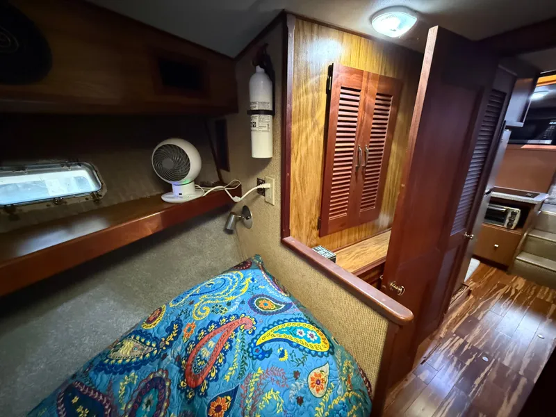 Slide: The Image of Cozy cabin interior of 1980 Viking 43 Double Cabin with vibrant bedding and wooden accents. - 39