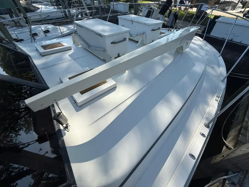 Slide: The Image of 1980 Viking 43 Double Cabin yacht deck with hatches and railing in marina. - 4