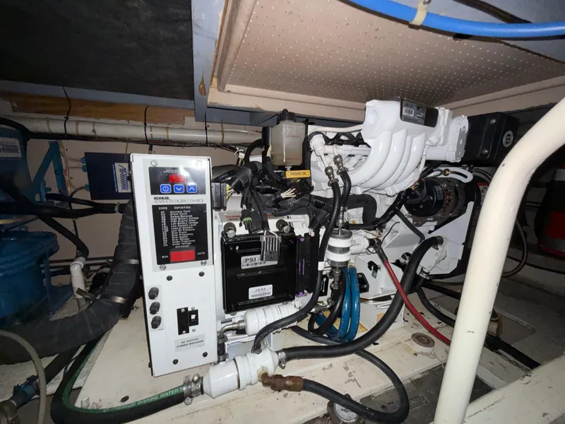 Slide: The Image of Engine room of a 1980 Viking 43 Double Cabin boat, showcasing mechanical components. - 42