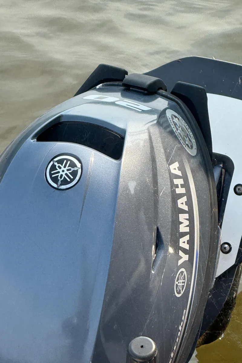 Slide: The Image of Yamaha outboard motor on a Viking 43 Double Cabin, 1980 model, near water. - 44