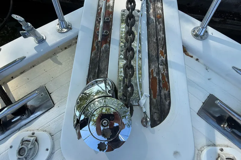 Slide: The Image of Anchor chain and winch on 1980 Viking 43 Double Cabin boat deck. - 6