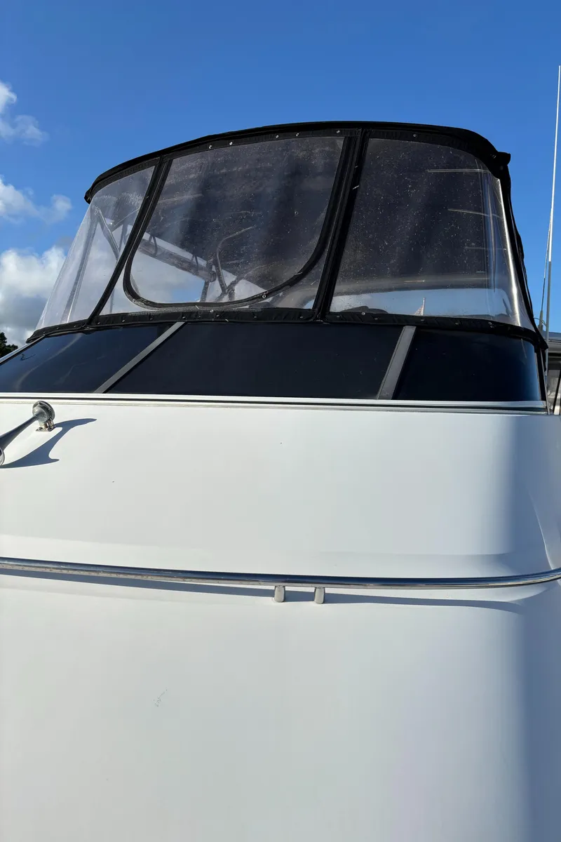 Slide: The Image of 2001 Carver 396 Aft Cabin MY yacht with clear blue sky background. - 13