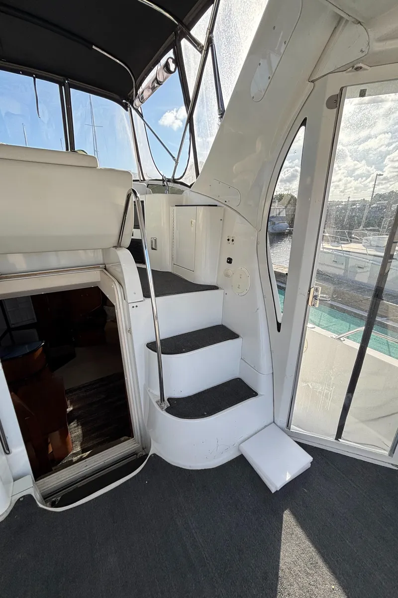 Slide: The Image of 2001 Carver 396 Aft Cabin MY interior with stairs and seating area. - 25