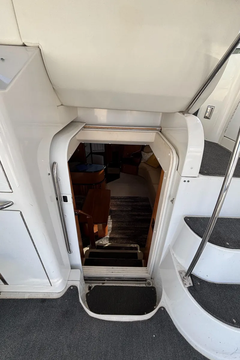 Slide: The Image of 2001 Carver 396 Aft Cabin MY interior entrance with stairs and seating area. - 42
