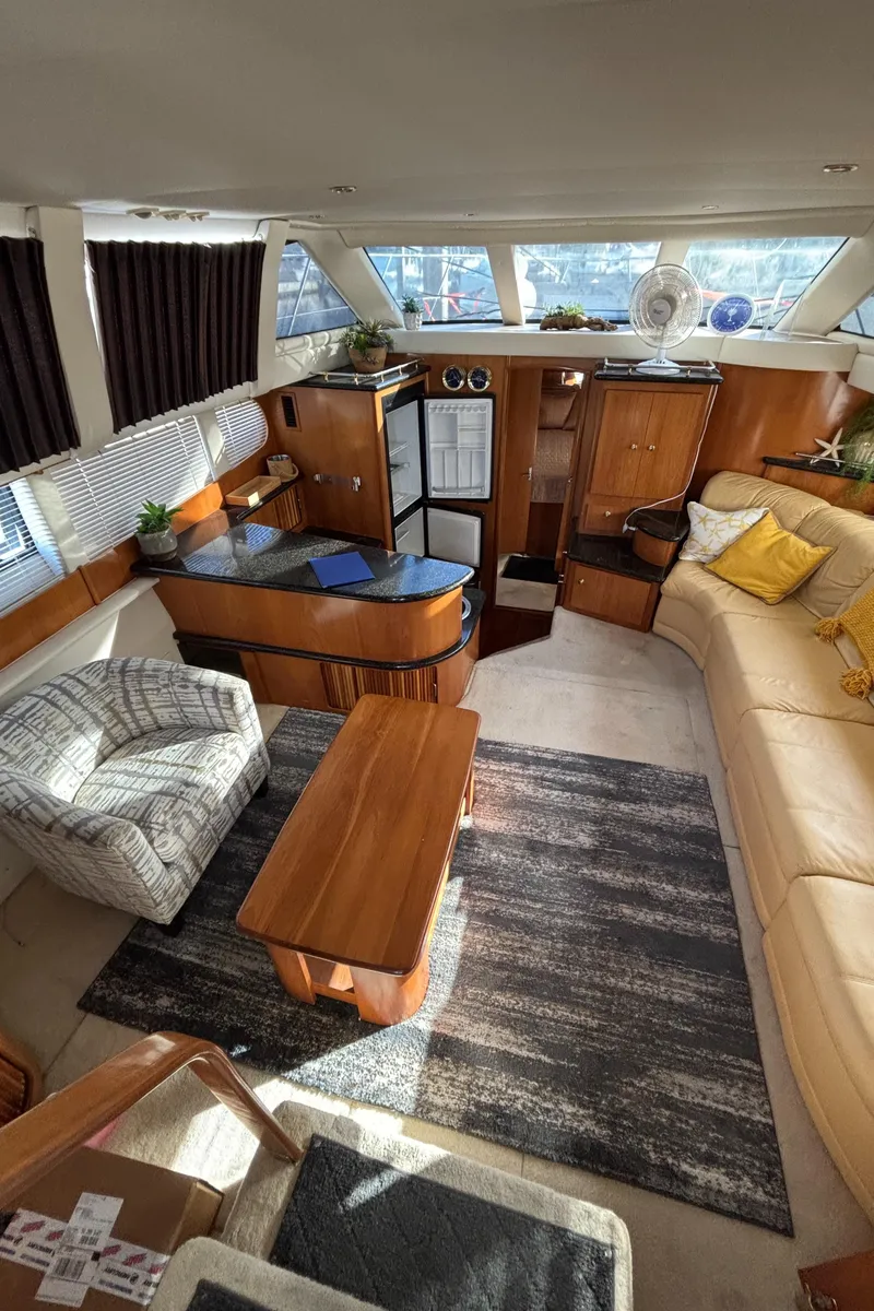 Slide: The Image of Luxurious interior of 2001 Carver 396 Aft Cabin MY yacht with elegant furnishings. - 44