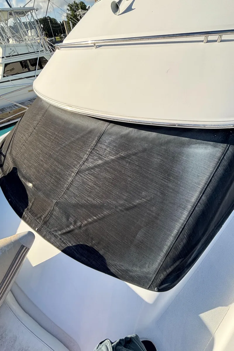 Slide: The Image of 2001 Carver 396 Aft Cabin MY boat with covered windshield in marina. - 14