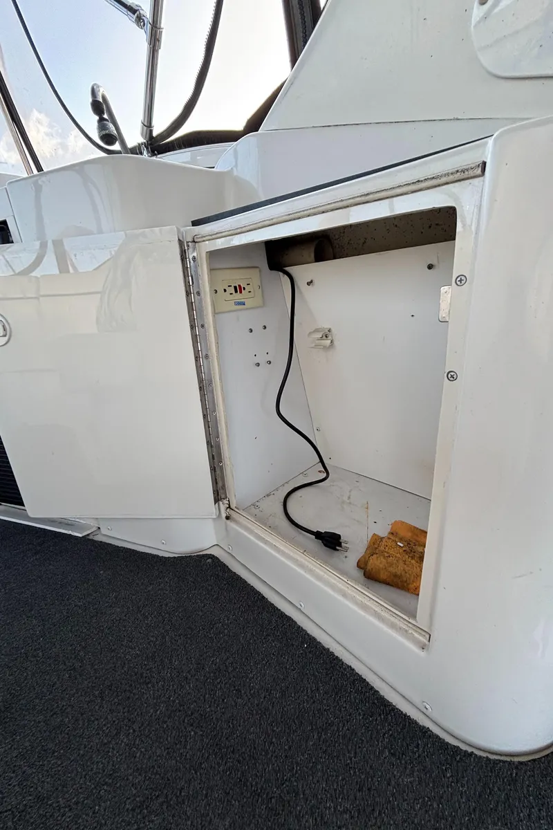 Slide: The Image of Open storage compartment on 2001 Carver 396 Aft Cabin MY boat. - 23