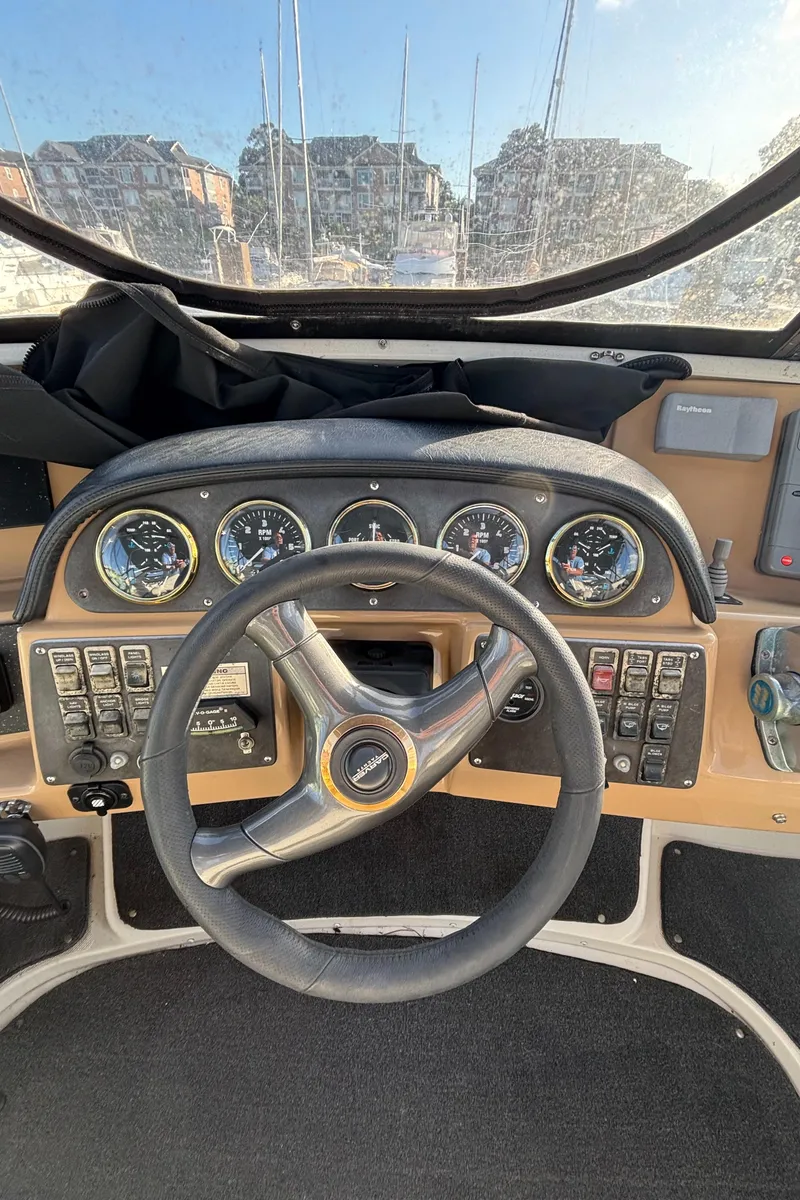 Slide: The Image of 2001 Carver 396 Aft Cabin MY helm with gauges and steering wheel. - 27