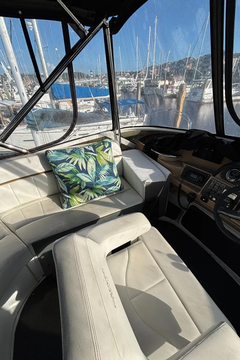 Slide: The Image of Interior of 2001 Carver 396 Aft Cabin MY with plush seating and tropical pillow. - 33