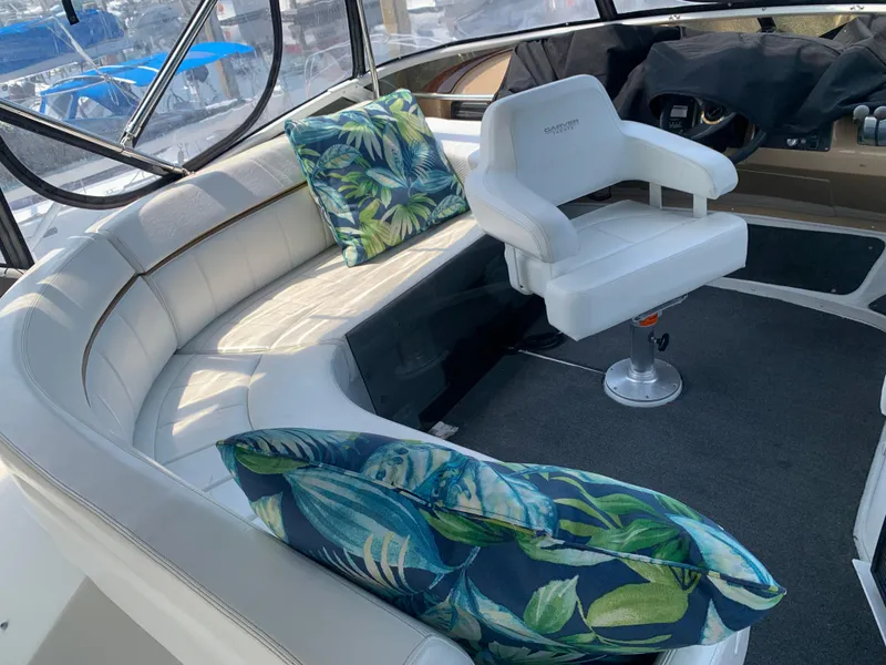Slide: The Image of 2001 Carver 396 Aft Cabin MY interior with white seating and tropical cushions. - 37