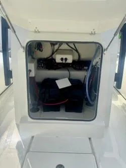 Slide: The Image of 2026 Brig Navigator boat storage compartment with equipment and wiring. - 10