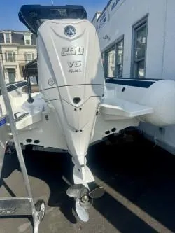 Slide: The Image of 2026 Brig Navigator boat with powerful 250 V6 engine, docked outdoors. - 3