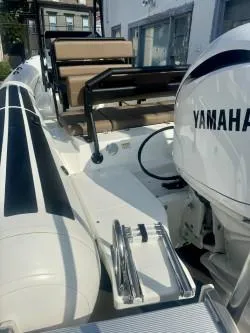 Slide: The Image of 2026 Brig Navigator boat with Yamaha engine, featuring sleek design and comfortable seating. - 4