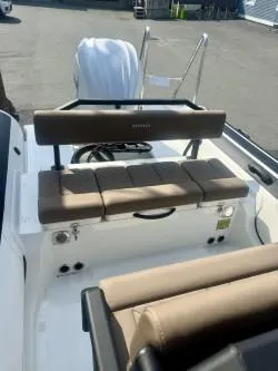 Slide: The Image of 2026 Brig Navigator boat interior with cushioned seating and storage. - 5