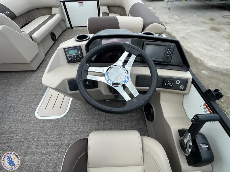Slide: The Image of 2025 Bennington 21 SL boat dashboard with steering wheel and control panel. - 7