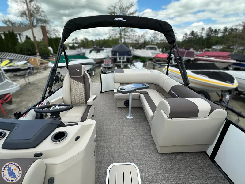 Slide: The Image of 2025 Bennington 21 SL pontoon boat with spacious seating and modern design. - 9